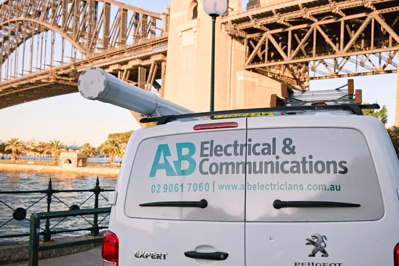 AB Electricians van on a Sydney street near the Harbour Bridge