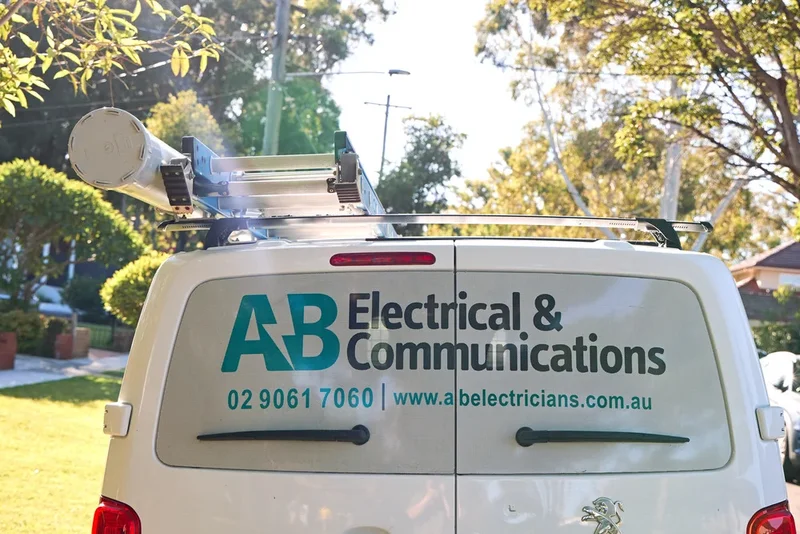 AB Electricians van rear with contact details